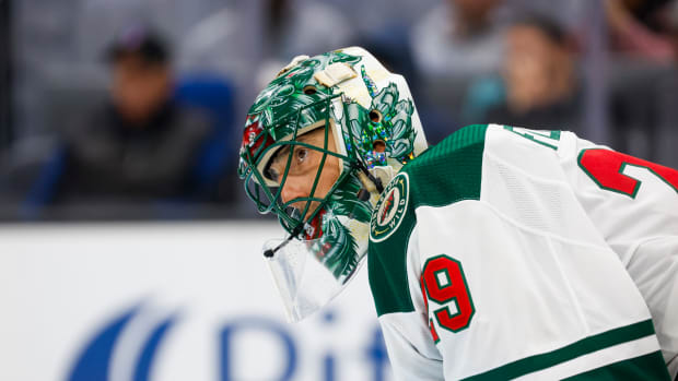 Feb 24, 2024; Seattle, Washington, USA; Minnesota Wild goaltender Marc-Andre Fleury (29) speaks with a teammate before a face off against the Seattle Kraken during the third period at Climate Pledge Arena.